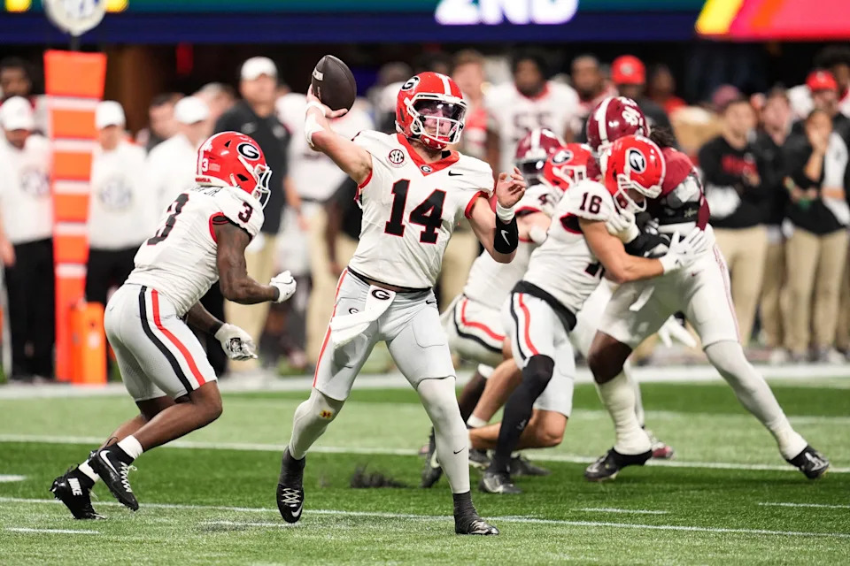 Dec 6, 2025; Atlanta, GA, USA; Georgia Bulldogs quarterback Gunner Stockton (14) throws a pass during the second quarter against the Alabama Crimson Tide during the 2025 SEC Championship game at Mercedes-Benz Stadium. Mandatory Credit: Dale Zanine-Imagn Images