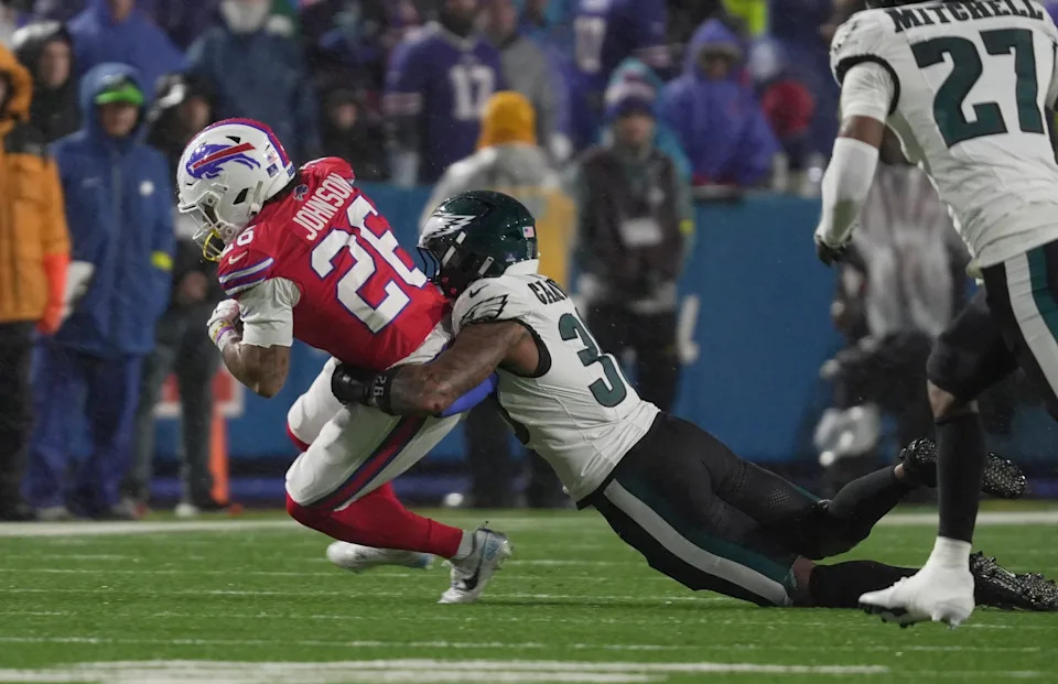 Buffalo Bills running back Ty Johnson is taken down by Philadelphia Eagles linebacker Jihaad Campbell during second half action against the Philadelphia Eagles at Highmark Stadium in Orchard Park on Dec. 28, 2025.