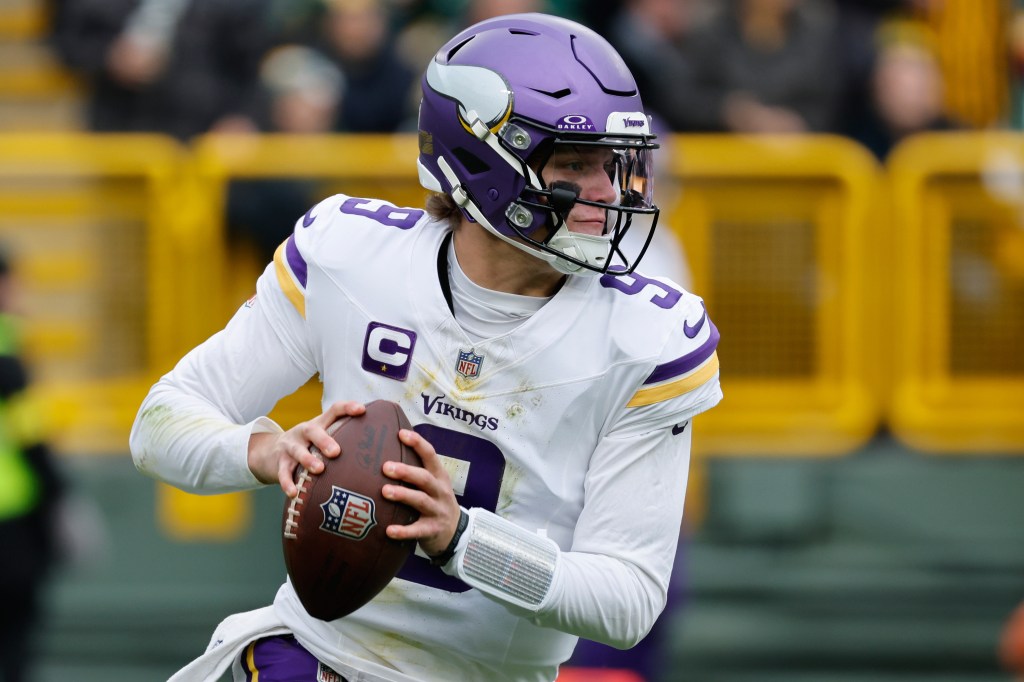 Minnesota Vikings quarterback J.J. McCarthy (9) looks to pass.