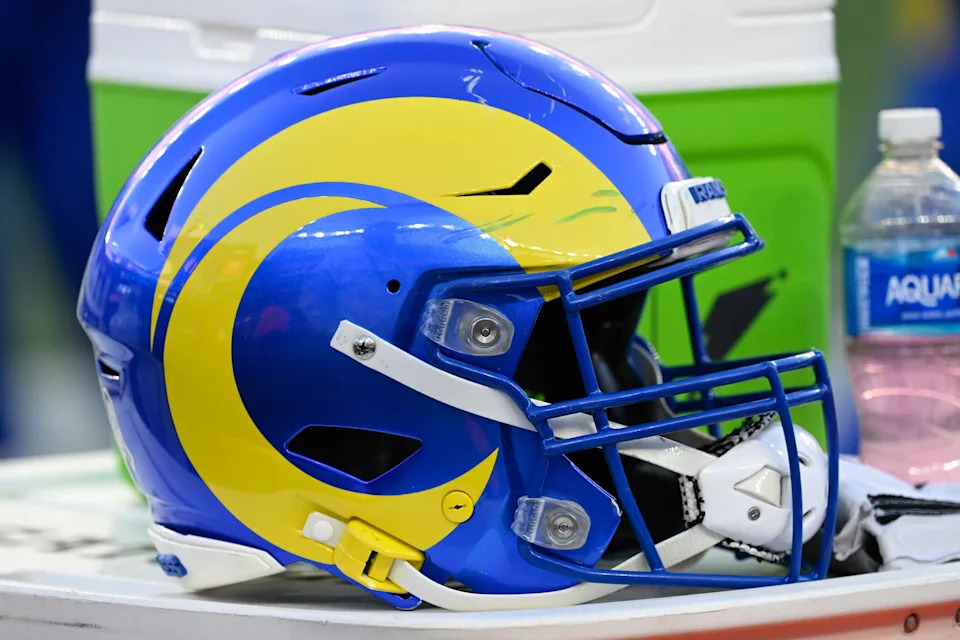 A Los Angeles Rams helmet sits on a cooler.