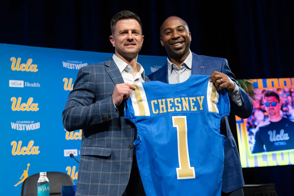 Los Angeles, CA - December 09: New UCLA football head coach Bob Chesney, left, and UCLA Athletic Director Martin Jarmon pose for photos during a ceremony to introduce Chesney at UCLA in Westwood on Tuesday, December 9, 2025. (Photo by Hans Gutknecht/MediaNews Group/Los Angeles Daily News via Getty Images)