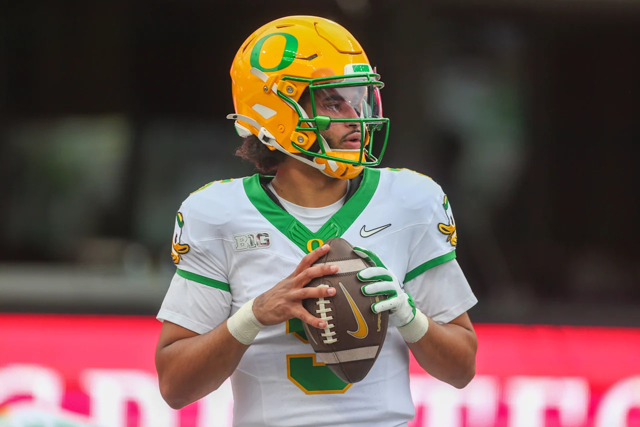 SEATTLE, WA - NOVEMBER 29:  Oregon (QB) #5 Dante Moore warms up during the college football game between the Washington Huskies and the Oregon Ducks on November 29th, 2025 at Husky Stadium in Seattle, WA. (Photo by Jesse Beals/Icon Sportswire via Getty Images)