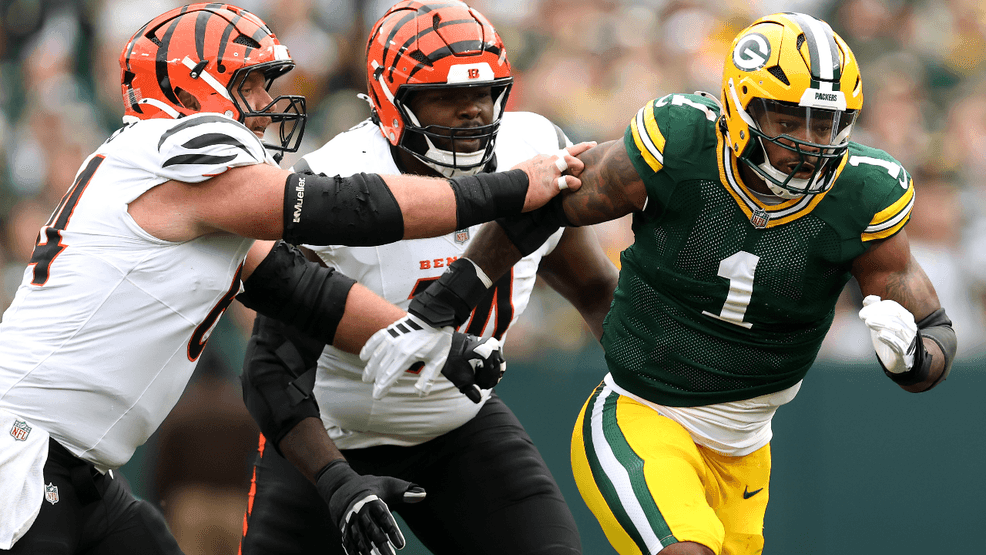 Micah Parsons #1 of the Green Bay Packers rushes past Ted Karras #64 and Jalen Rivers #74 of the Cincinnati Bengals during the second quarter in the game at Lambeau Field on October 12, 2025 in Green Bay, Wisconsin. (Photo by Michael Reaves/Getty Images)