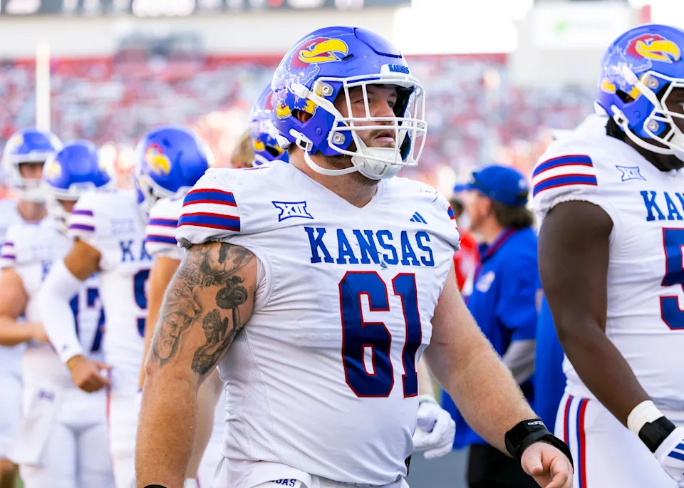 Nov 8, 2025; Tucson, Arizona, USA; Kansas Jayhawks offensive lineman Bryce Foster (61) against the Arizona Wildcats at Arizona Stadium. Mandatory Credit: Mark J. Rebilas-Imagn Images