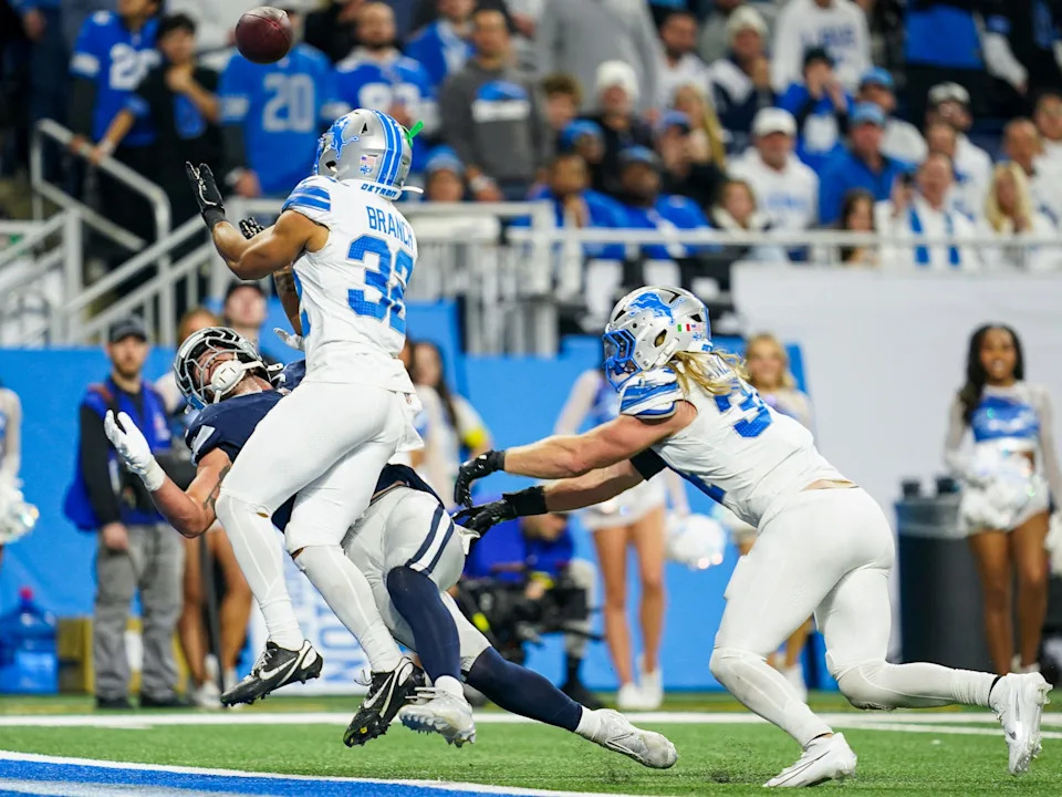 Detroit Lions safety Brian Branch (32) jumps for a catch against the Dallas Cowboys during the second half at Ford Field in Detroit on Thursday, Dec. 4, 2025.