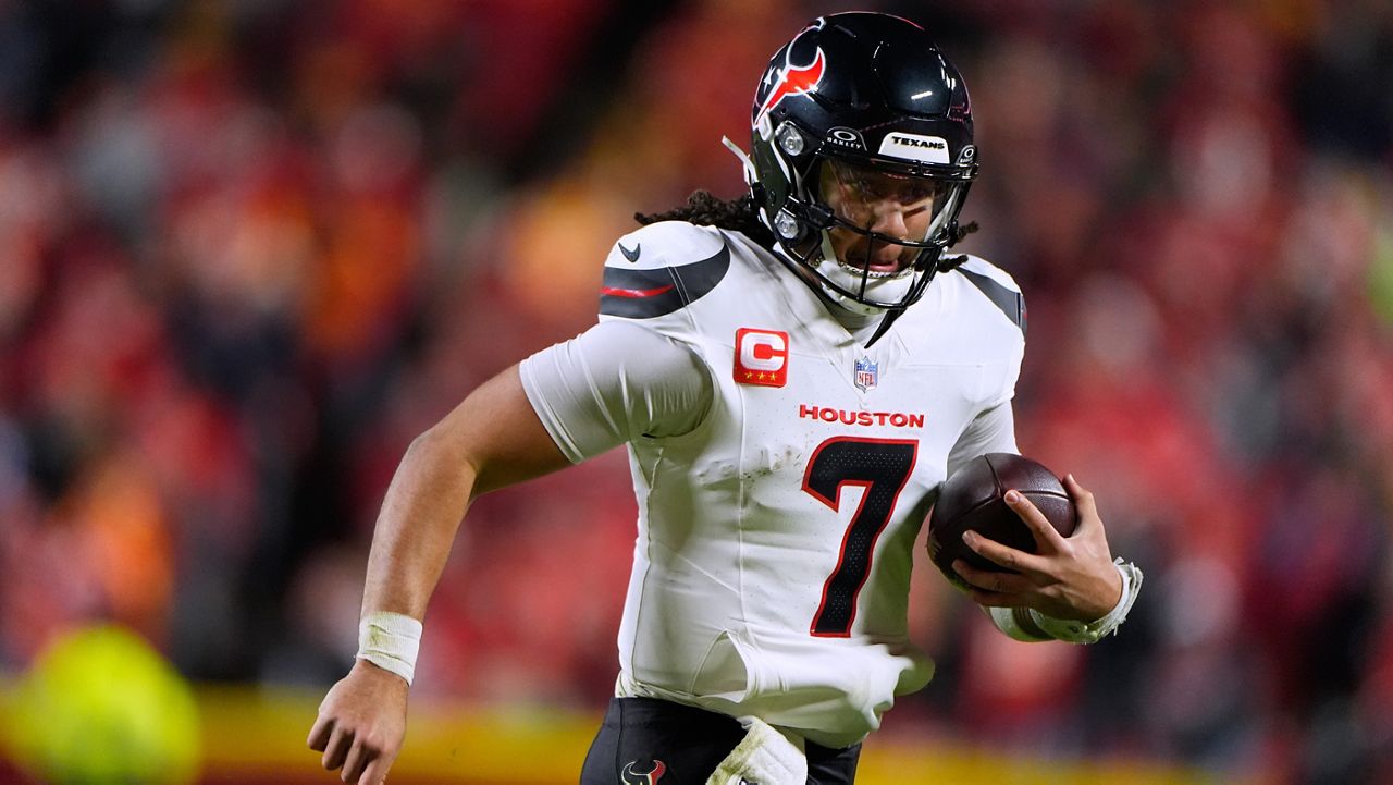 Houston Texans quarterback C.J. Stroud scrambles during the second half of an NFL football game against the Kansas City Chiefs Sunday, Dec. 7, 2025, in Kansas City, Mo. (AP Photo/Charlie Riedel)