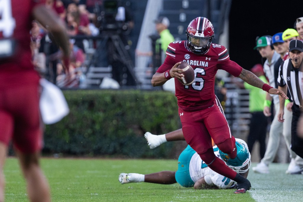South Carolina quarterback Lanorris Sellers (16) tiptoes for a first down against the Coastal Carolina during the first half of an NCAA college football game, Saturday, Nov. 22, 2025, in Columbia, S.C. 