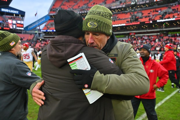 CLEVELAND, OHIO - NOVEMBER 30: Head coach Kyle Shanahan of the San Francisco 49ers and head coach Kevin Stefanski of the Cleveland Browns hug after San Francisco's 26-8 win at Huntington Bank Field on November 30, 2025 in Cleveland, Ohio. (Photo by Jason Miller/Getty Images)
