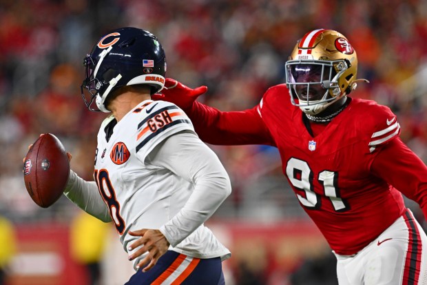 San Francisco 49ers' Sam Okuayinonu (91) chases down Chicago Bears quarterback Caleb Williams (18) in the fourth quarter of their NFL game at Levi's Stadium in Santa Clara, Calif., on Sunday, Dec. 28, 2025. The San Francisco 49ers defeated the Chicago Bears 42-38. (Jose Carlos Fajardo/Bay Area News Group)