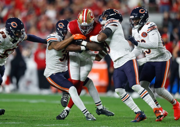 San Francisco 49ers' Brian Robinson Jr. (3) is tackled at the end of a run against the Chicago Bears in the first quarter at Levi's Stadium in Santa Clara, Calif., on Sunday, Dec. 28, 2025. (Nhat V. Meyer/Bay Area News Group)