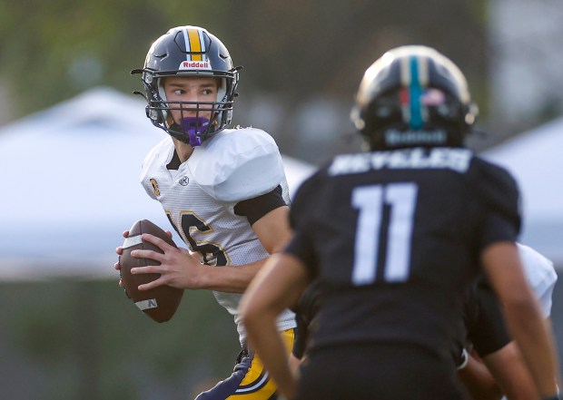 Lincoln's Luca Papoulias (16) looks the throw the ball against Valley Center's Brandon Revelas (11) in the first quarter during the Division 6-AA state football championship game at Fullerton Union High School District Stadium in Fullerton, Calif., on Friday, Dec. 12, 2025. (Shae Hammond/Bay Area News Group)