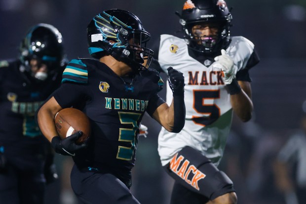 Kennedy-Delano's Cristian Hernandez (3) runs with the ball against McClymonds' Jessie King Jr (5) in the second quarter during Division 3-A state championship football game at Fullerton Union High School District Stadium in Fullerton, Calif., on Saturday, Dec. 13, 2025. (Shae Hammond/Bay Area News Group)