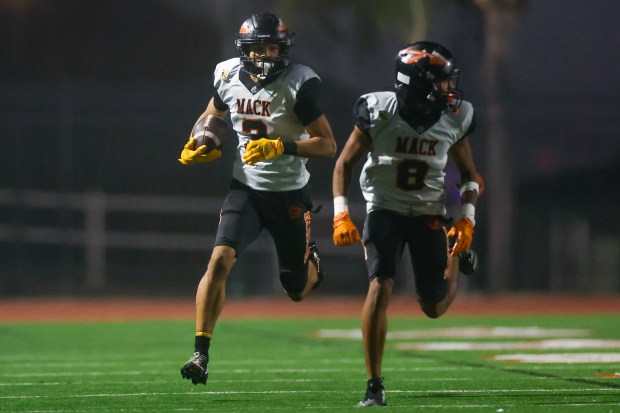 McClymonds' Prince Staten (3) runs with the ball with McClymonds' Dominic Davis (8) against Kennedy-Delano in the third quarter during the Division 3-A state championship football game at Fullerton Union High School District Stadium in Fullerton, Calif., on Saturday, Dec. 13, 2025. (Shae Hammond/Bay Area News Group)