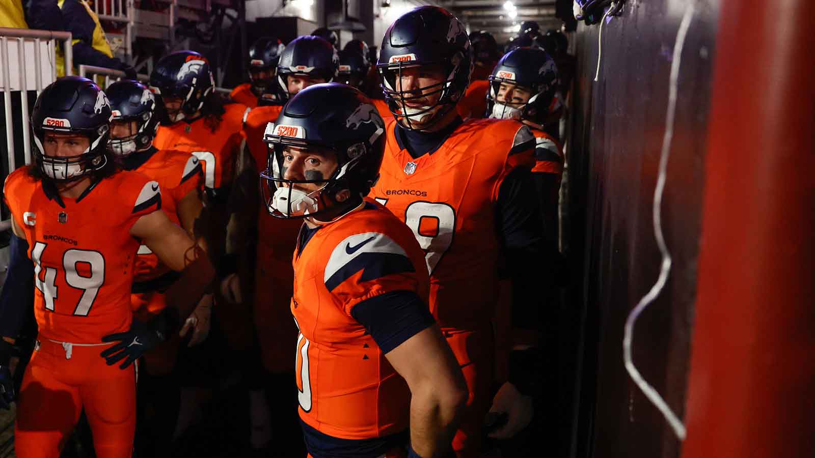 Denver Broncos quarterback Bo Nix (10) waits in the tunnel with teammates before the game against the Washington Commanders at Northwest Stadium.