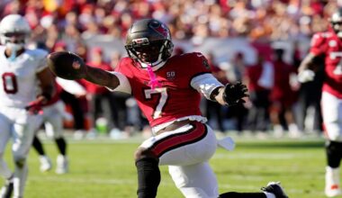 Tampa Bay Buccaneers running back Bucky Irving (7) celebrates a touchdown run as Will Johnson (0) looks on during the second half of an NFL football game Sunday, Nov. 30, 2025, in Tampa, Fla. (AP Photo/Chris O'Meara)