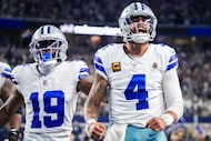 Dallas Cowboys quarterback Dak Prescott (4) celebrates with wide receiver Ryan Flournoy (19)...