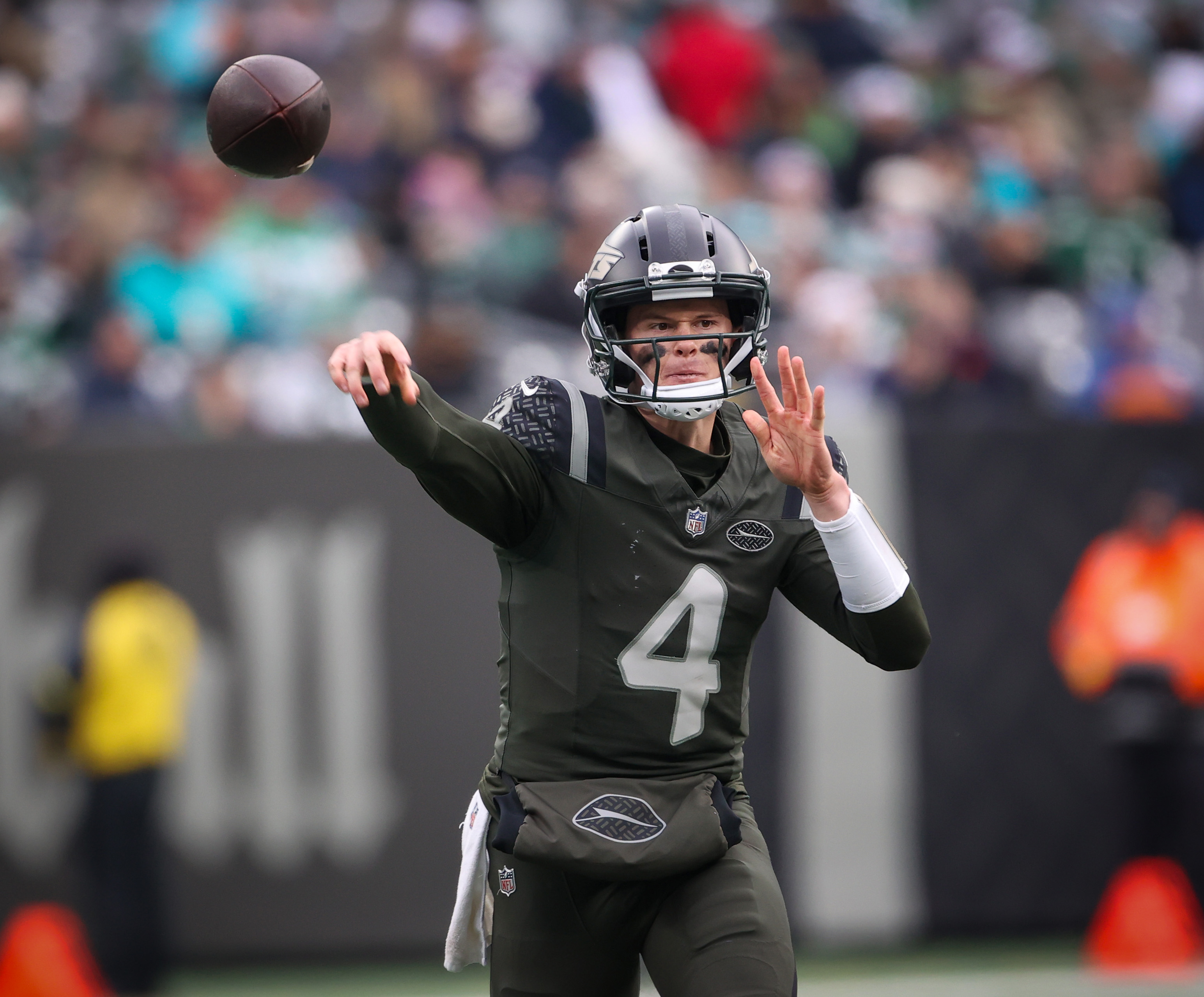 New York Jets rookie quarterback Brady Cook (4) throws a. Pass during the second quarter against the Miami Dolphins, Sunday, Dec. 7, 2025 at MetLife Stadium in East Rutherford, N.J. Cook came into the game after starter Tyrod Taylor was injured in the first quarter.