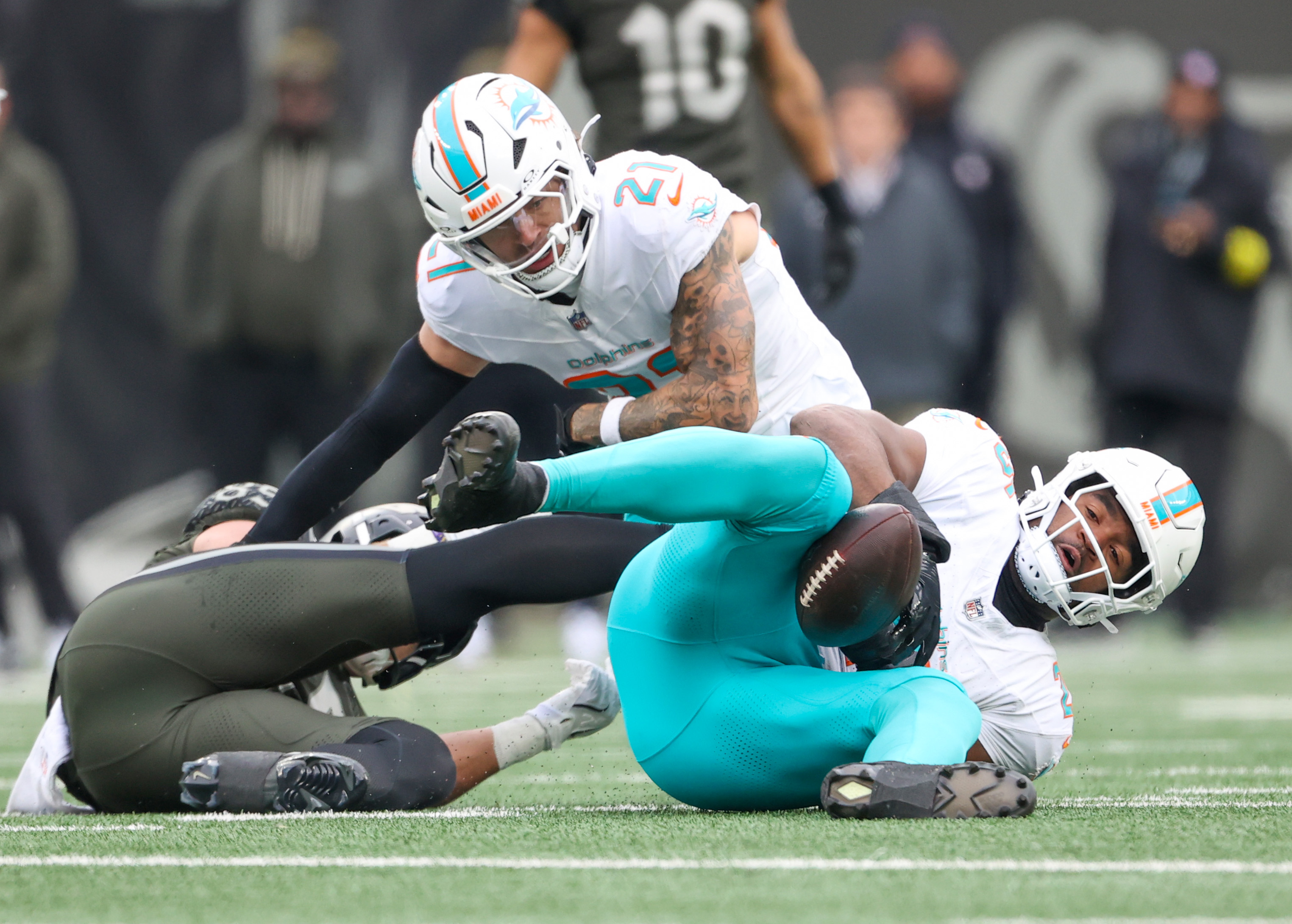 Miami Dolphins linebacker Tyrel Dodson (25, right) intercepts a pass intended for New York Jets tight end Mason Taylor (85, right), during the first quarter, Sunday, Dec. 7, 2025 at MetLife Stadium in East Rutherford, N.J.