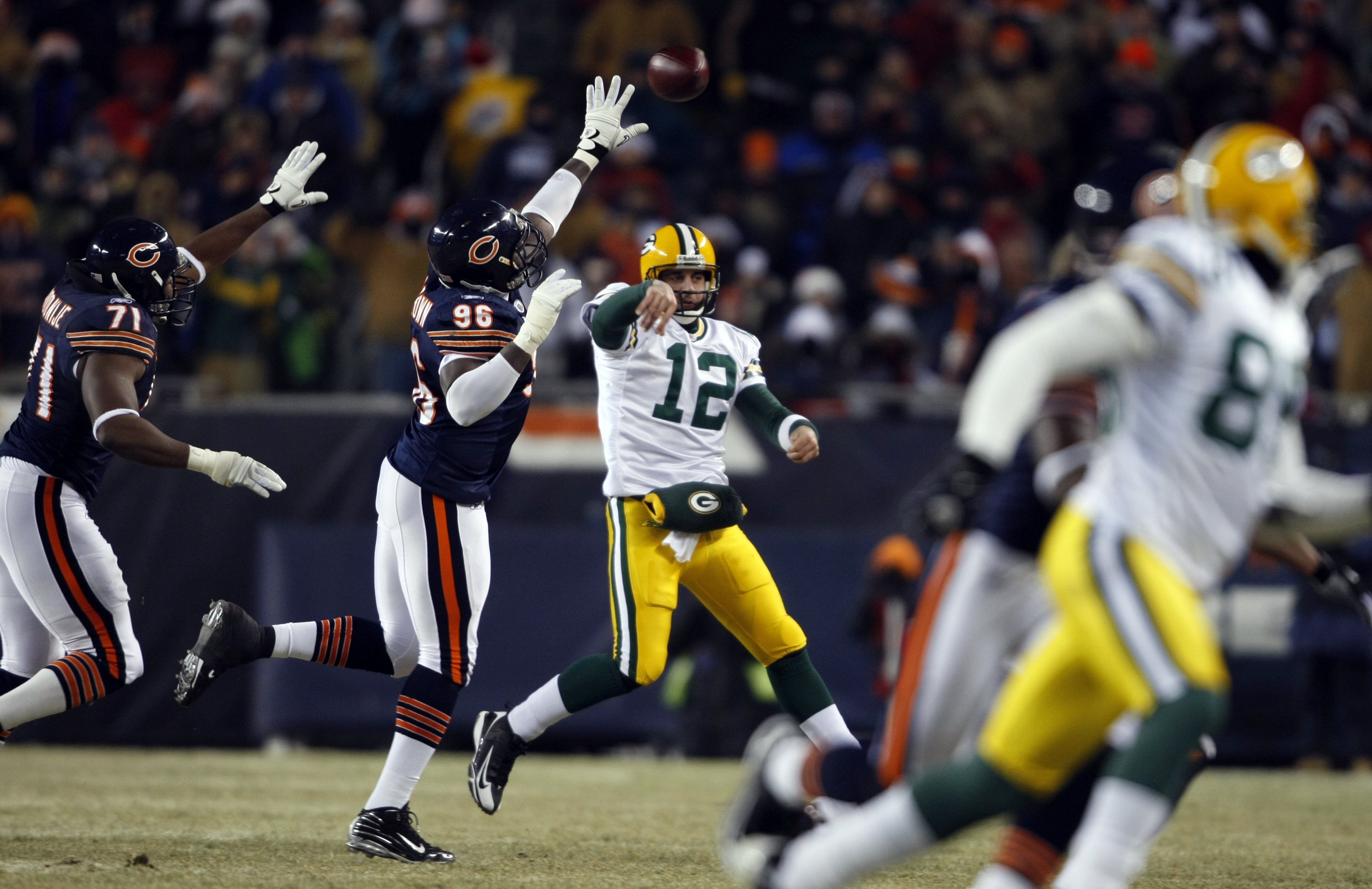 Chicago Bears' Alex Brown and Israel Idonije chase Green Bay...
