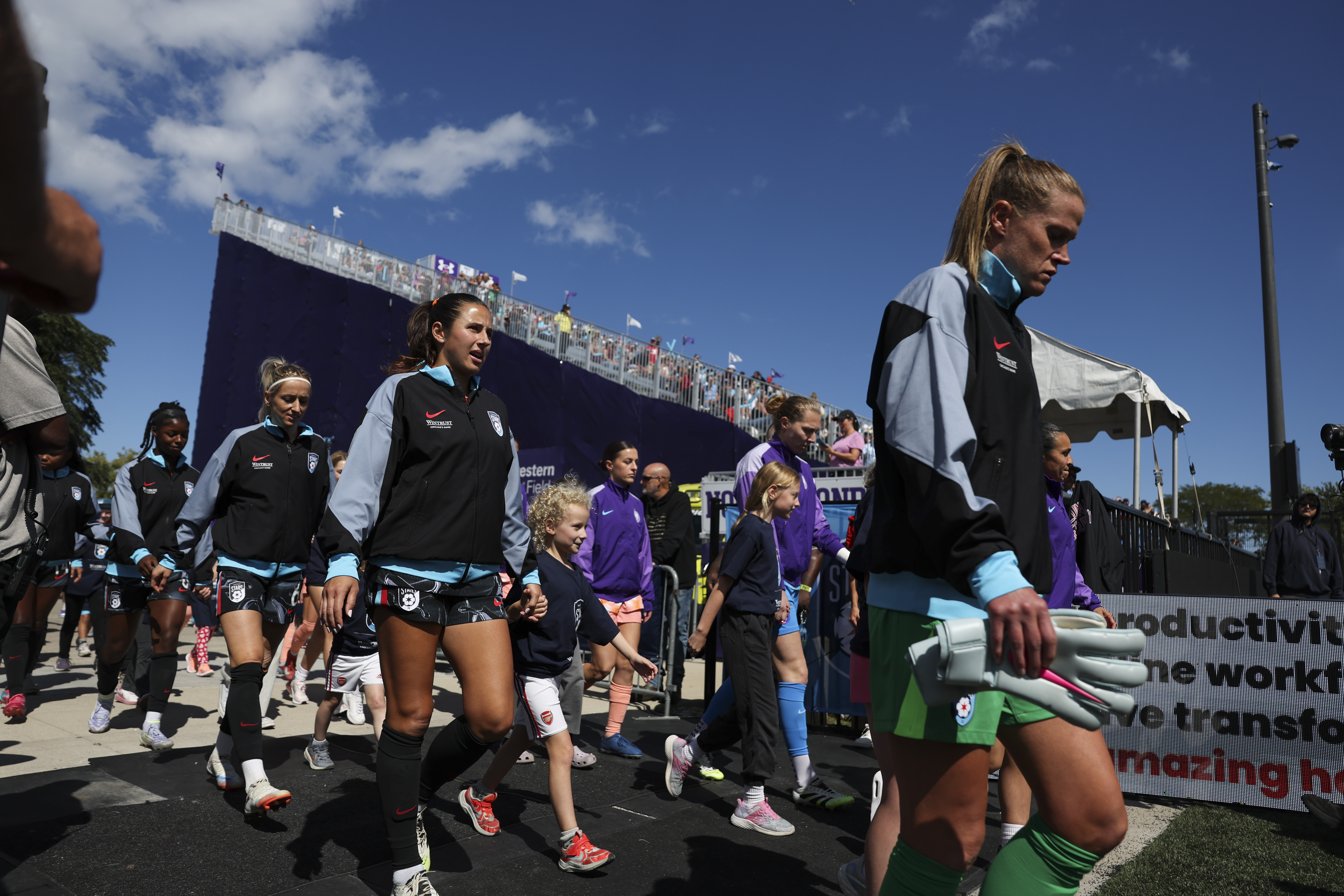 The Chicago StarsÂ and Orlando Pride players walk onto the field...