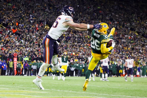Green Bay Packers cornerback Keisean Nixon (25) intercepts a pass intended for Chicago Bears tight end Cole Kmet (85) in the fourth quarter on the Bears' 4th-and-one at Lambeau Field in Green Bay on Sunday, Dec. 7, 2025, before the Chicago Bears play the Green Bay Packers. (Eileen T. Meslar/Chicago Tribune)