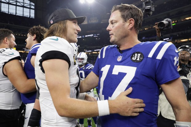 Jaguars quarterback Trevor Lawrence, left, and Colts quarterback Philip Rivers interact after the Jaguars won 23-17 on Sunday, Dec. 28, 2025, at Lucas Oil Stadium in Indianapolis. (Michael Hickey/Getty Images)