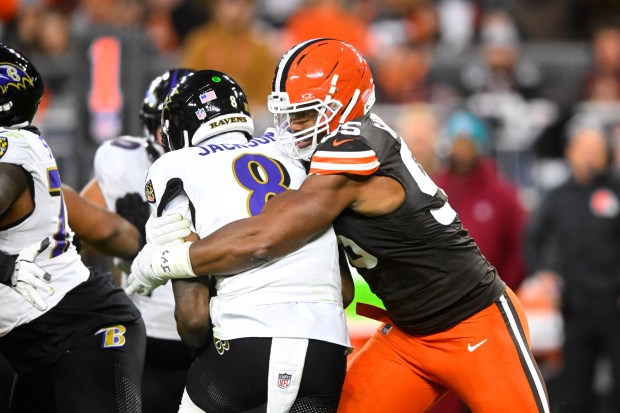 Browns defensive end Myles Garrett sacks Ravens quarterback Lamar Jackson on Nov. 16, 2025, in Cleveland. (AP Photo/David Richard)