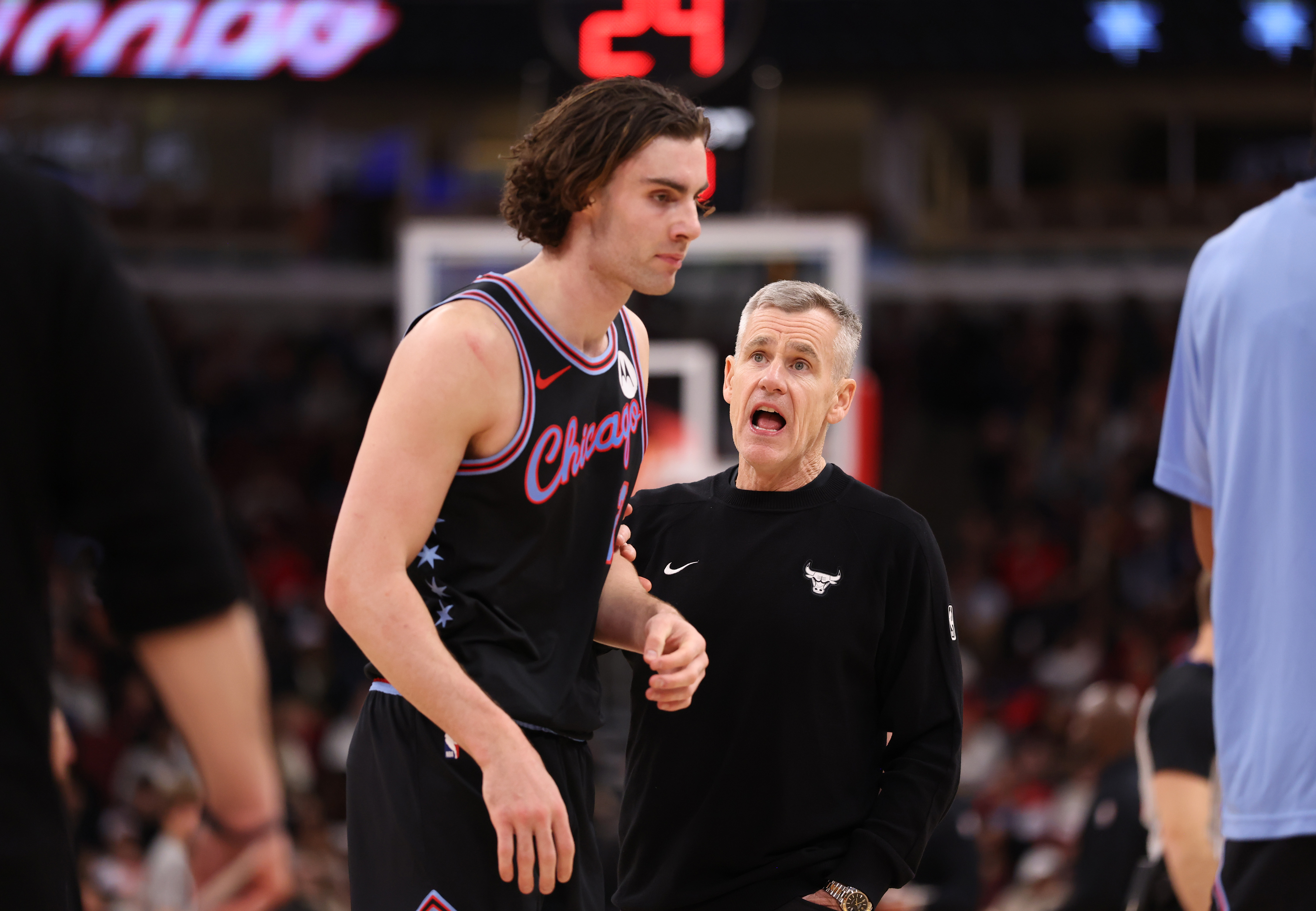 Bulls head coach Billy Donovan talks with guard Josh Giddey...