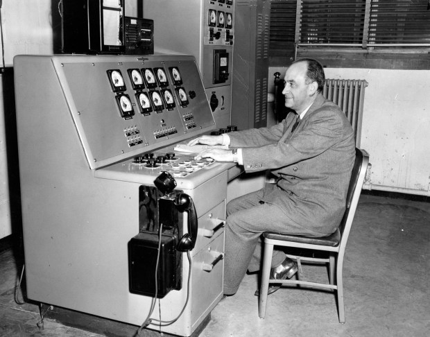 Enrico Fermi at the controls of a 100 million volt betatron at the University of Chicago on May 2, 1950. (Chicago Tribune historical photo)