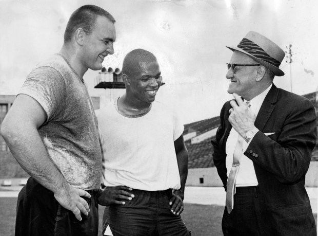 Chicago Bears owner and coach George Halas, right, with top draft picks Dick Butkus, left, and Gale Sayers, at an informal gathering in Soldier Field before the players left for All-Star camp on July 9, 1965. (Phil Mascione/Chicago Tribune)