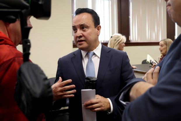 Cook County Board of Review Commissioner George Cardenas talks with media following a news conference in Chicago on Dec. 4, 2025. (Antonio Perez/Chicago Tribune)