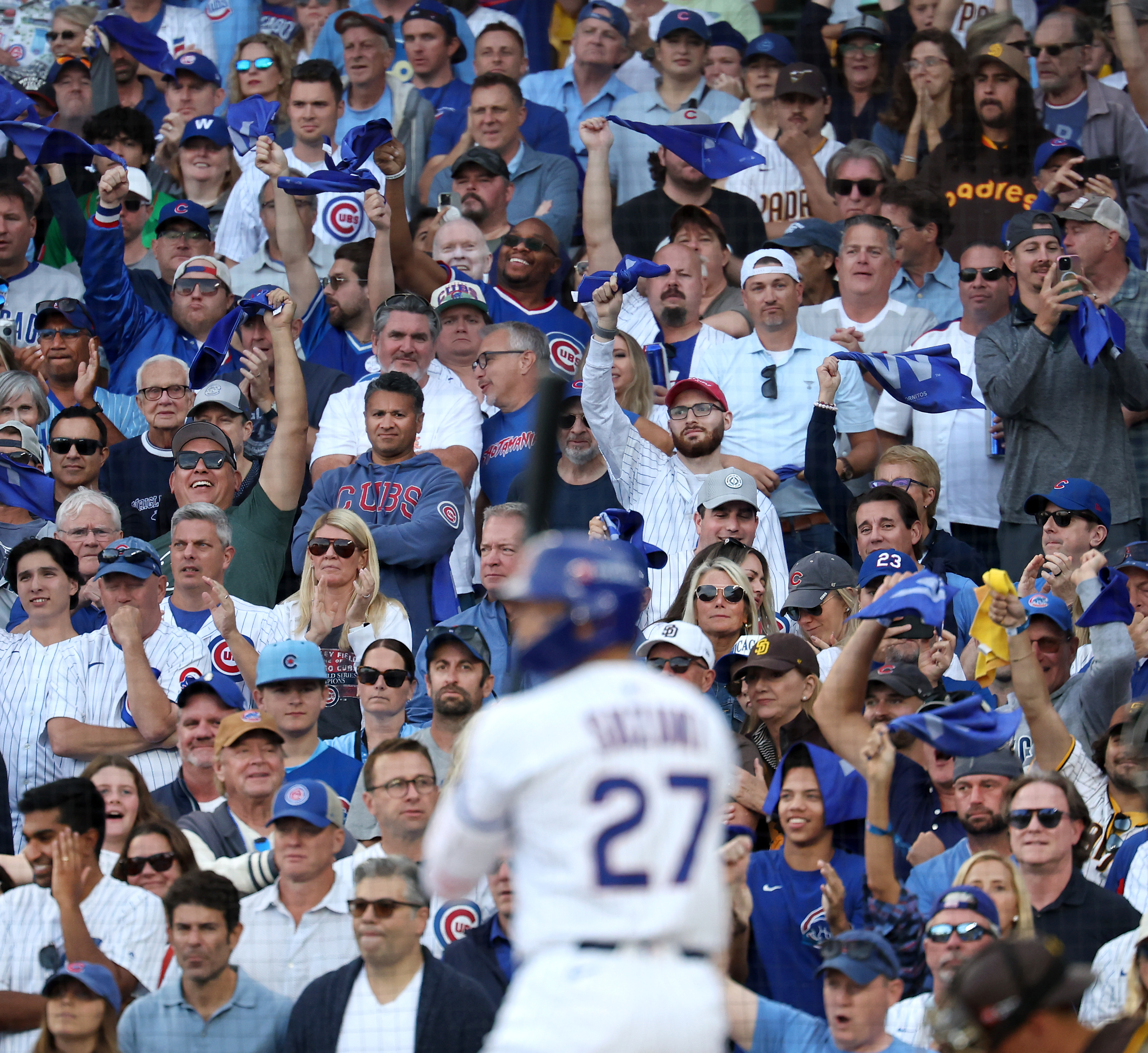 Chicago Cubs fans try to rally the team as Chicago...