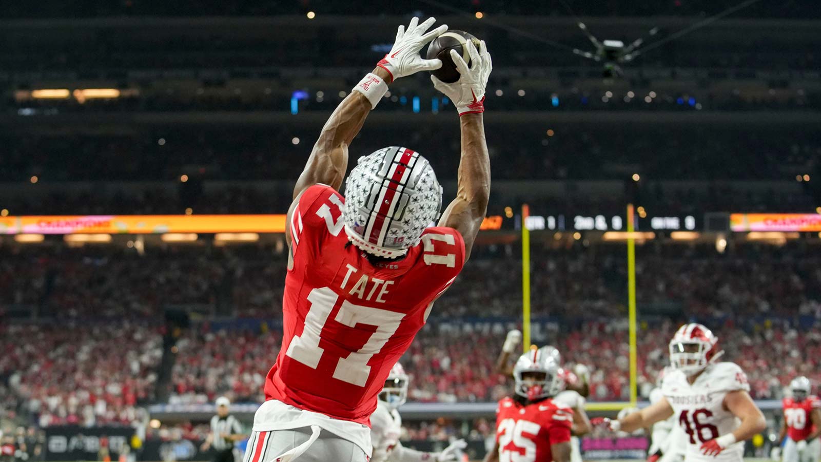 Ohio State Buckeyes wide receiver Carnell Tate (17) makes a catch for a touchdown Saturday, Dec. 6, 2025, during the Big Ten football championship against the Indiana Hoosiers at Lucas Oil Stadium in Indianapolis.