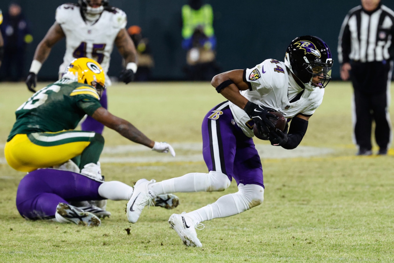 Baltimore Ravens cornerback Marlon Humphrey intercepts a pass during an NFL game against the Green Bay Packers on Saturday, Dec. 27, 2025, at Lambeau Field in Green Bay, Wis.