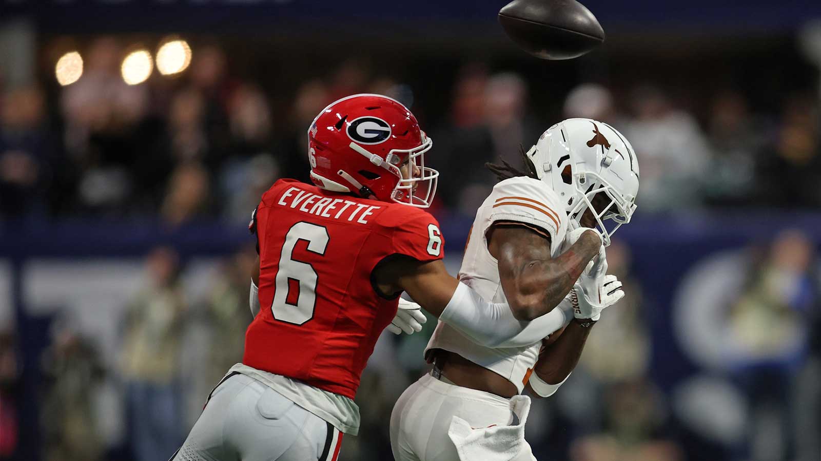 Georgia Bulldogs defensive back Daylen Everette (6) breaks up a pass intended for Texas Longhorns wide receiver Isaiah Bond (7) during the first half in the 2024 SEC Championship game at Mercedes-Benz Stadium.