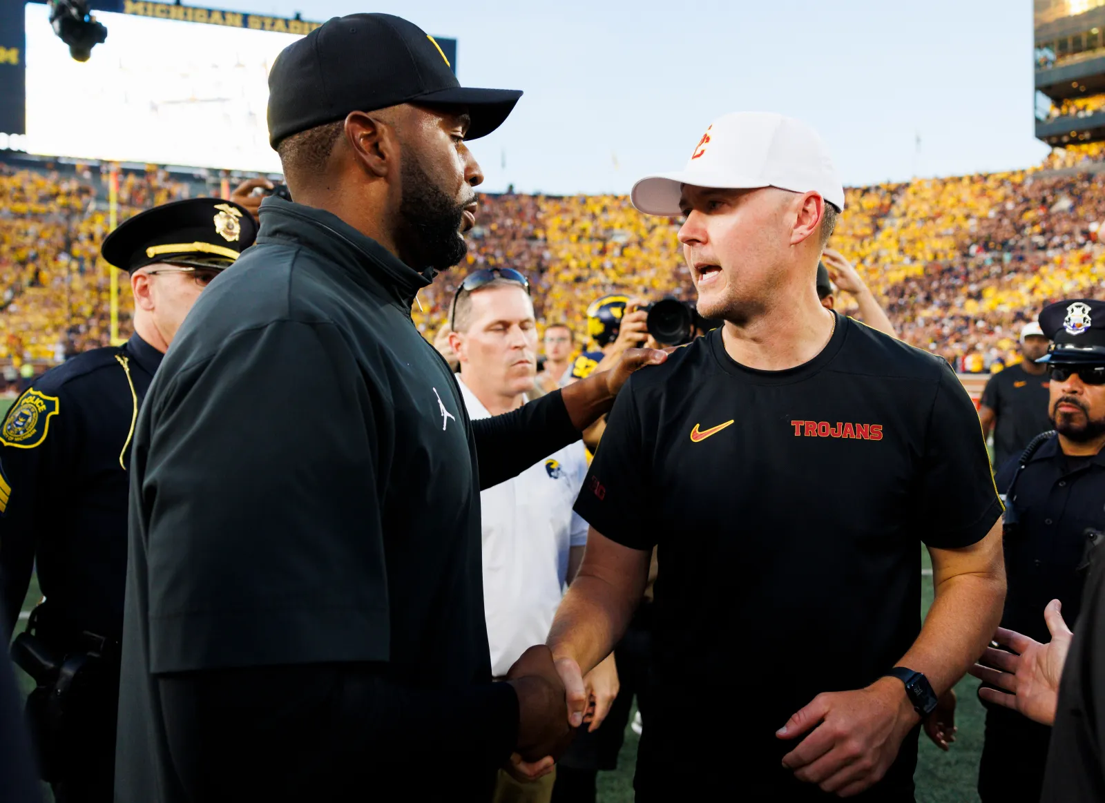 Sherrone Moore of the Michigan Wolverines and Lincoln Riley of the USC Trojans