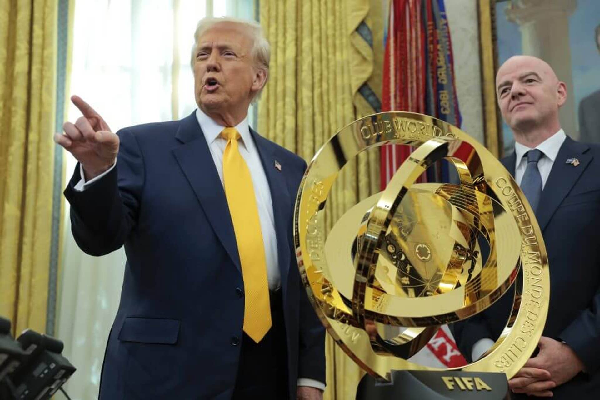 President Donald Trump speaks alongside FIFA President Gianni Infantino after unveiling the 2025 Club World Cup trophy in the Oval Office at the White House on March 7.