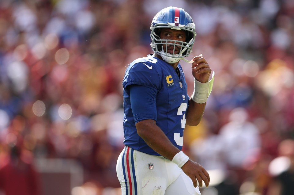 Russell Wilson #3 of the New York Giants looks on after turning the ball over on downs against the Washington Commanders