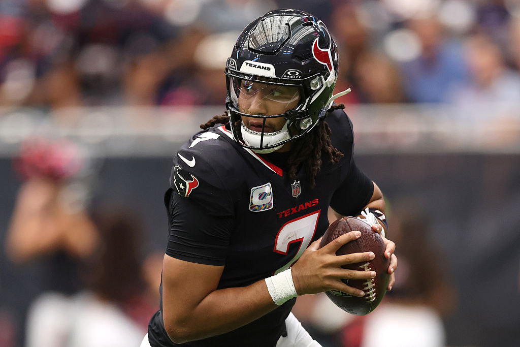 HOUSTON, TEXAS - SEPTEMBER 28: C.J. Stroud #7 of the Houston Texans rolls out against the Tennessee Titans during the first quarter in the game at NRG Stadium on September 28, 2025 in Houston, Texas. (Photo by Tim Warner/Getty Images)