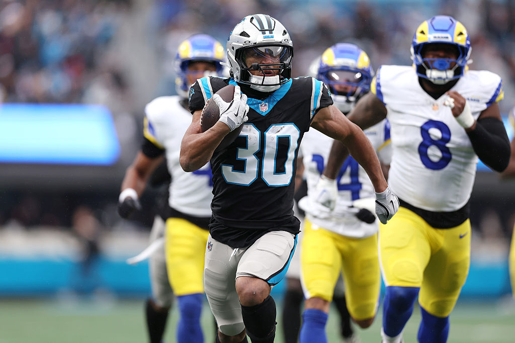 CHARLOTTE, NORTH CAROLINA - NOVEMBER 30: Chuba Hubbard #30 of the Carolina Panthers carries the ball and scores a touchdown against the Los Angeles Rams during the first quarter at Bank of America Stadium on November 30, 2025 in Charlotte, North Carolina. (Photo by David Jensen/Getty Images)