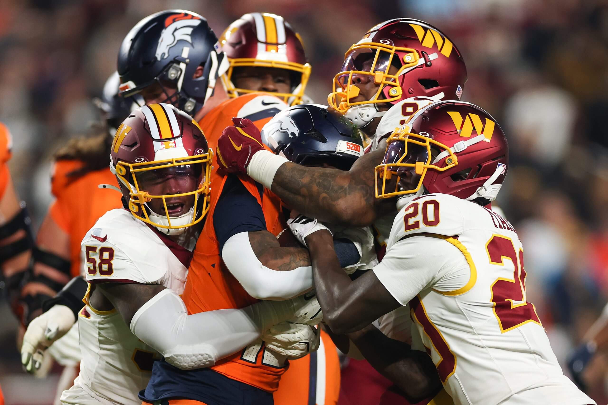 Washington Commanders defenders team up to stop Broncos running back RJ Harvey