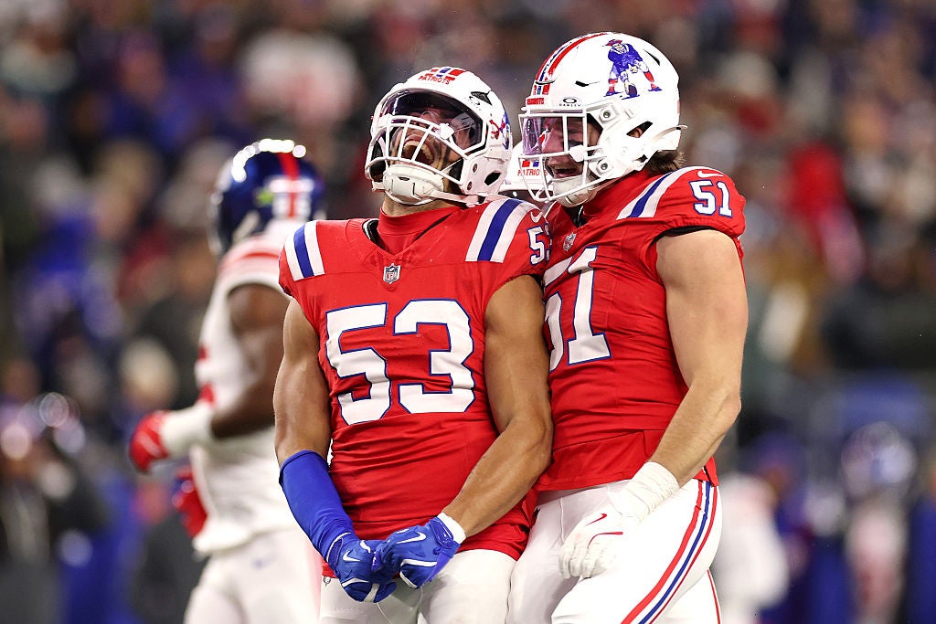 FOXBOROUGH, MASSACHUSETTS - DECEMBER 01: Christian Elliss #53 of the New England Patriots celebrates with Jack Gibbens #51 after a stop during the second quarter of the game against the New York Giants at Gillette Stadium on December 01, 2025 in Foxborough, Massachusetts. (Photo by Maddie Meyer/Getty Images)