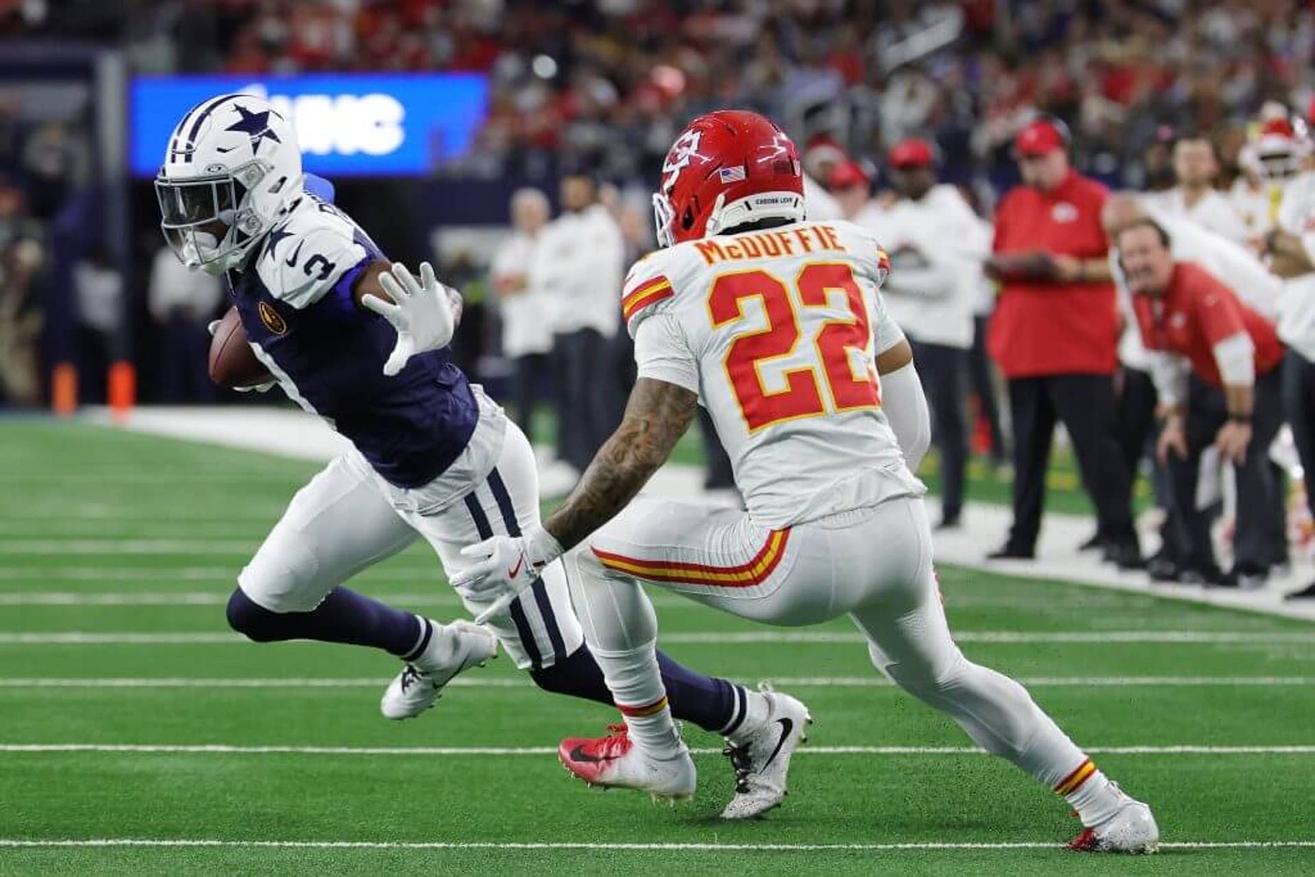 George Pickens #3 of the Dallas Cowboys is pursued by Trent McDuffie #22 of the Kansas City Chiefs during a game at AT&T Stadium on November 27, 2025 in Arlington, Texas. The Cowboys defeated the Chiefs 31-28.