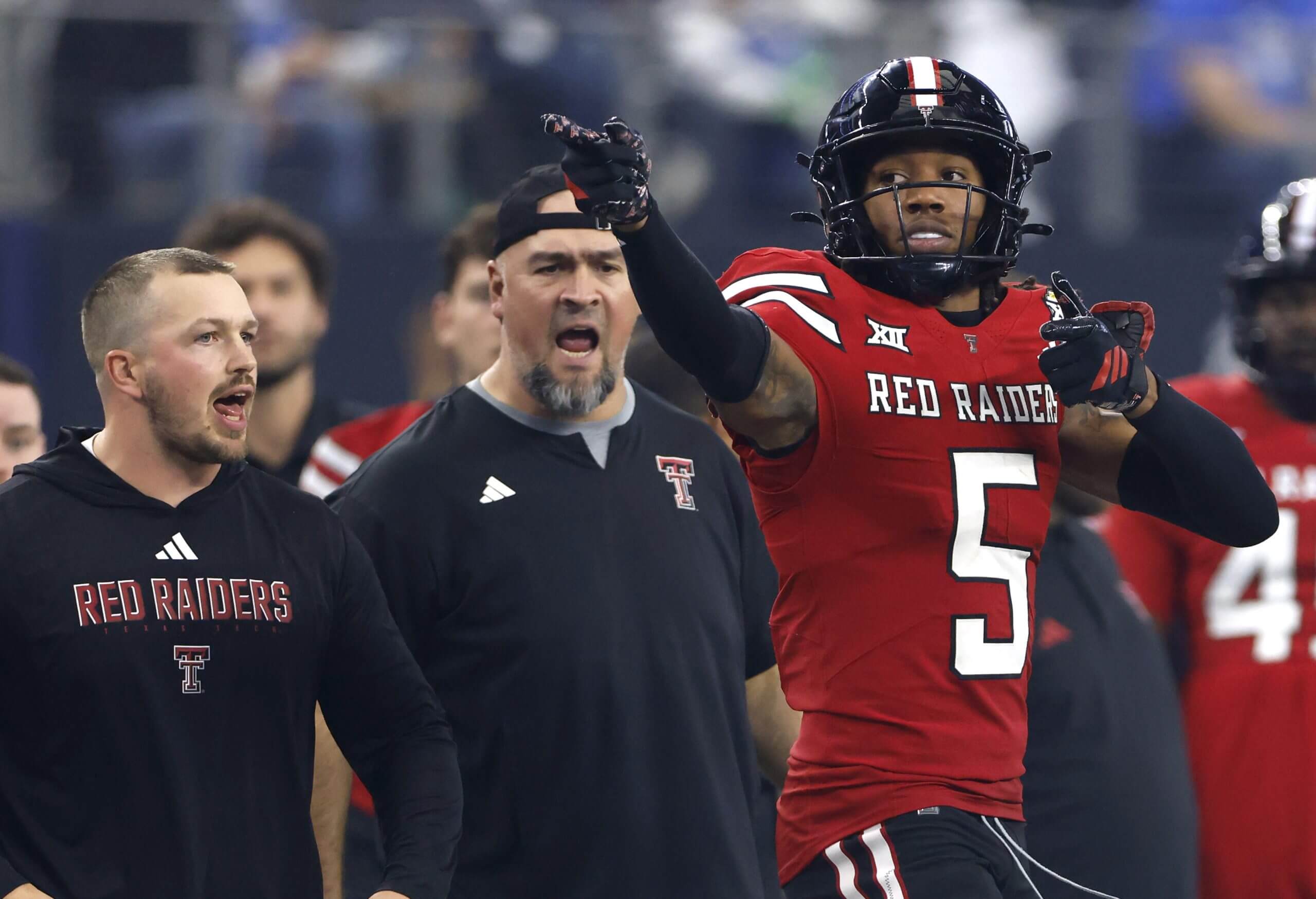 Caleb Douglas points down field after a first down.
