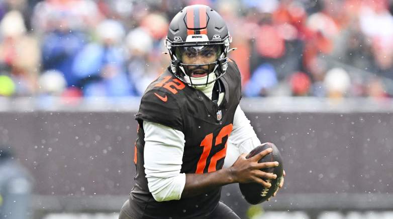 CLEVELAND, OHIO - DECEMBER 07: Jihad Ward #53 of the Tennessee Titans attempts to tackle Shedeur Sanders #12 of the Cleveland Browns during the first quarter at Huntington Bank Field on December 07, 2025 in Cleveland, Ohio. (Photo by Jason Miller/Getty Images)