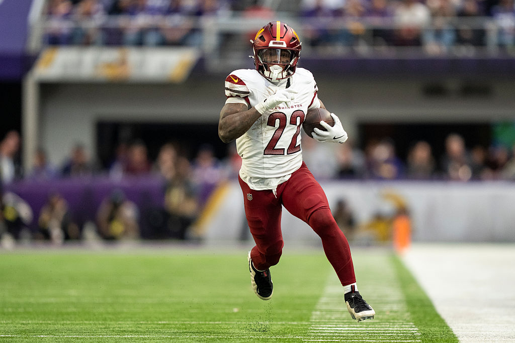 MINNEAPOLIS, MINNESOTA - DECEMBER 7: Jacory Croskey-Merritt #22 of the Washington Commanders runs with the ball during an NFL football game against the Minnesota Vikings at U.S. Bank Stadium on December 07, 2025 in Minneapolis, Minnesota. (Photo by Michael Owens/Getty Images)