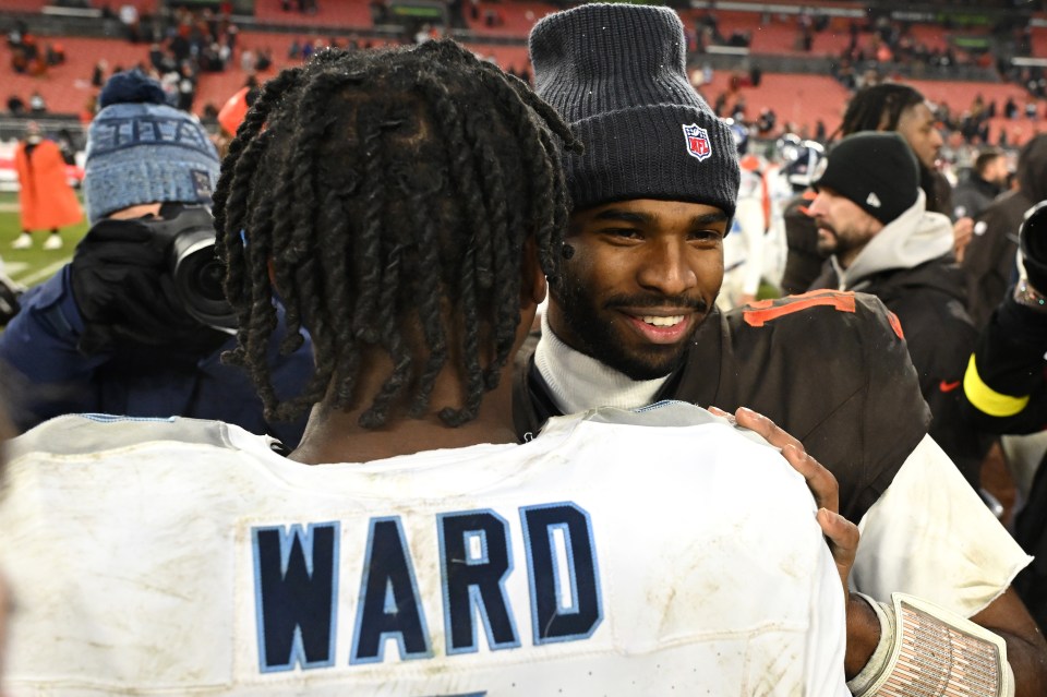 Cam Ward #1 of the Tennessee Titans and Shedeur Sanders #12 of the Cleveland Browns meet after the game at Huntington Bank Field