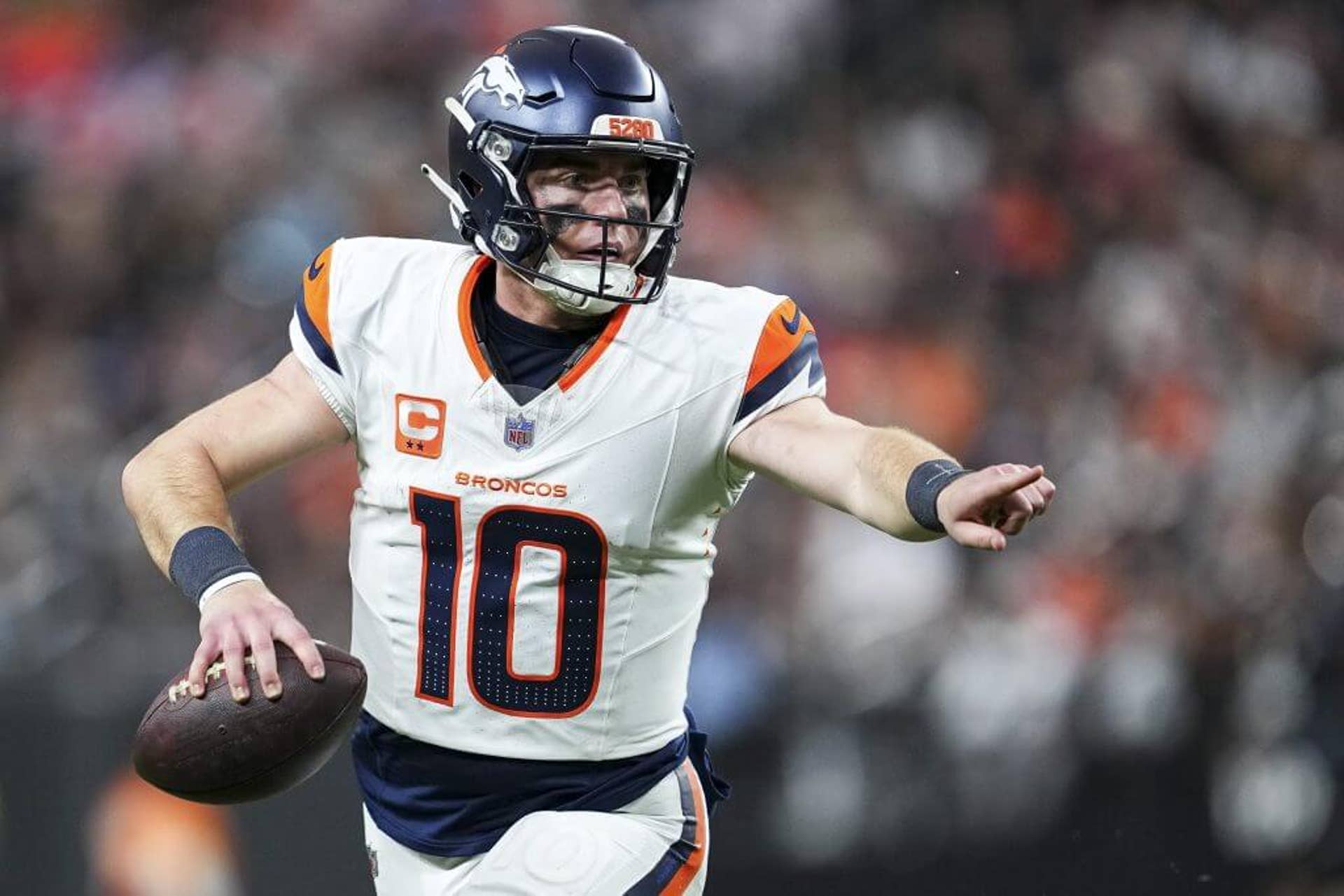 Broncos QB Bo Nix carries the ball during the fourth quarter against the Las Vegas Raiders at Allegiant Stadium.