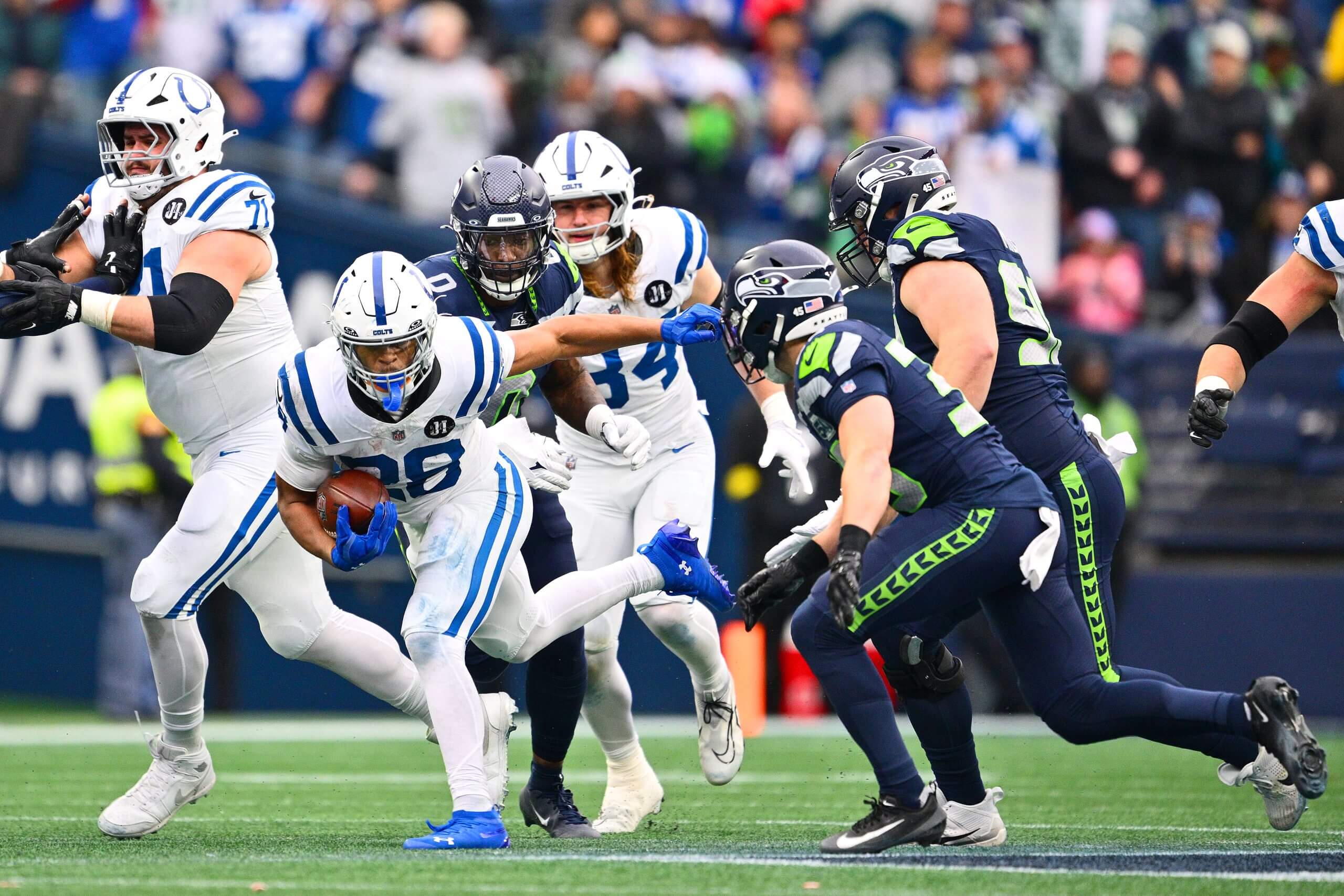 Jonathan Taylor #28 of the Indianapolis Colts carries the ball against the Seattle Seahawks during the second quarter at Lumen Field on Dec. 14.