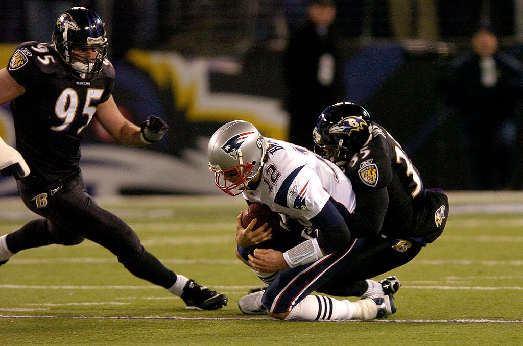 BALTIMORE - DECEMBER 3: Tom Brady #12 of the New England Patriots is sacked by Corey Ivy #35 of the Baltimore Ravens at M&T Bank Stadium December 3, 2007 in Baltimore, Maryland. (Photo by Greg Fiume/Getty Images)